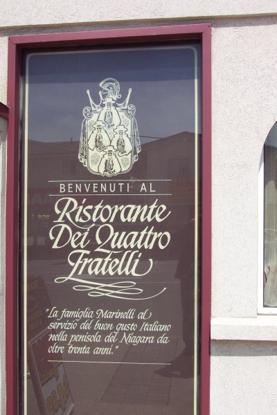Italian on the window of Four Brothers Restaurant